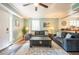 Living room area is furnished with sofas, lamps and a wooden chest coffee table at 4297 Earney Rd, Woodstock, GA 30188