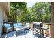 Cozy patio furniture on deck with grill at 4297 Earney Rd, Woodstock, GA 30188