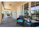 Relaxing porch with wicker chairs and a porch swing at 4297 Earney Rd, Woodstock, GA 30188
