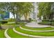 Landscaped courtyard with tiered seating and lush greenery at 44 Peachtree Nw Pl # 1828, Atlanta, GA 30309