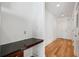 Bright entryway with hardwood floors, built-in desk, and access to other rooms at 44 Peachtree Nw Pl # 1828, Atlanta, GA 30309