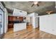 Modern kitchen with wood cabinetry, granite counters, and stainless steel appliances at 44 Peachtree Nw Pl # 1828, Atlanta, GA 30309