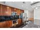 Modern kitchen with granite countertops and stainless steel appliances at 44 Peachtree Nw Pl # 1828, Atlanta, GA 30309