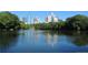 Scenic lake view with city skyline in background at 44 Peachtree Nw Pl # 1828, Atlanta, GA 30309