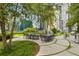 Community grilling area with a large table and surrounding seating at 44 Peachtree Nw Pl # 1828, Atlanta, GA 30309