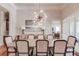 Formal dining room with hardwood floors, a large chandelier, and a spacious table at 4760 Highland Point Dr, Auburn, GA 30011