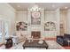 Living room with built-in shelving, fireplace, and hardwood floors at 4760 Highland Point Dr, Auburn, GA 30011