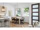 Light-filled dining area with wood table and chairs near the kitchen at 520 Wabash Ne Ave # B, Atlanta, GA 30312