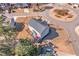 Aerial view of a property with a deck and patio, overlooking a well-manicured lawn and neighborhood at 115 Greenbrier Way, Canton, GA 30114