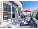 Relaxing back deck features outdoor seating, black metal railing, and views of the backyard at 115 Greenbrier Way, Canton, GA 30114