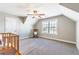 Attic bedroom with unique architecture, carpeted floors, and an inviting window seat at 115 Greenbrier Way, Canton, GA 30114