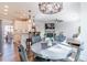 Elegant dining area with stylish lighting, views of the living spaces, and seating for six at 115 Greenbrier Way, Canton, GA 30114