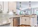 Well-appointed kitchen with granite countertops, stainless steel appliances, and ample cabinet space at 115 Greenbrier Way, Canton, GA 30114