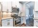 Modern kitchen with stainless steel appliances, granite countertops, and subway tile backsplash at 115 Greenbrier Way, Canton, GA 30114