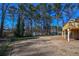 Spacious backyard with a partially fenced area at 1357 Ridgewood Dr, Lilburn, GA 30047