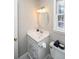 Small bathroom featuring white vanity and toilet at 1357 Ridgewood Dr, Lilburn, GA 30047