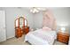 Cozy bedroom with a bed, dresser and canopy at 1357 Ridgewood Dr, Lilburn, GA 30047