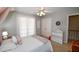 bedroom featuring a bed, dresser and shelves at 1357 Ridgewood Dr, Lilburn, GA 30047