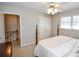 Bedroom with post bed, and access to upstairs hallway at 1357 Ridgewood Dr, Lilburn, GA 30047