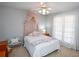 bedroom with bed, canopy and built-in shelves at 1357 Ridgewood Dr, Lilburn, GA 30047