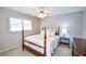Cozy bedroom with a post bed and neutral color scheme at 1357 Ridgewood Dr, Lilburn, GA 30047