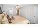 King-size bed in this well-lit bedroom with ensuite bathroom and access to hallway at 1357 Ridgewood Dr, Lilburn, GA 30047