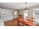 Eat-in kitchen with hardwood floors and view of backyard at 1357 Ridgewood Dr, Lilburn, GA 30047