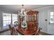 Elegant dining room with hardwood floors, a chandelier, and a china cabinet at 1357 Ridgewood Dr, Lilburn, GA 30047