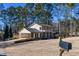 Two-story house with a large backyard and a detached garage at 1357 Ridgewood Dr, Lilburn, GA 30047