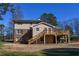 Two-story house with large deck and expansive backyard at 1357 Ridgewood Dr, Lilburn, GA 30047