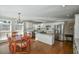 Spacious kitchen featuring an island, hardwood floors, and a breakfast area at 1357 Ridgewood Dr, Lilburn, GA 30047