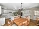 Open kitchen with white cabinets, granite counters, and hardwood floors at 1357 Ridgewood Dr, Lilburn, GA 30047