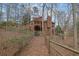 Spacious backyard showcases the multi-level deck and outdoor living areas of the home, surrounded by mature trees at 3457 Winter Wood Cv, Marietta, GA 30062