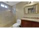 Bathroom featuring a glass shower enclosure and wooden vanity with granite countertop at 3457 Winter Wood Cv, Marietta, GA 30062