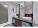 Bathroom featuring dual sinks with granite countertops and dark wood cabinetry at 3457 Winter Wood Cv, Marietta, GA 30062