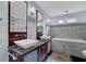 Bathroom offers dual sinks, marble tiling, and a bathtub at 3457 Winter Wood Cv, Marietta, GA 30062