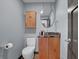 Powder room featuring a wood cabinet with granite countertop and oval mirror at 3457 Winter Wood Cv, Marietta, GA 30062