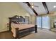Bedroom featuring a king bed, ceiling fan, and lots of natural light at 3457 Winter Wood Cv, Marietta, GA 30062