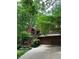 Charming home with an exterior showcasing lush greenery and a winding driveway at 3457 Winter Wood Cv, Marietta, GA 30062