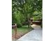 Inviting home with lush landscaping, a curved driveway, and classic mailbox at 3457 Winter Wood Cv, Marietta, GA 30062