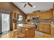 This open kitchen is appointed with a granite countertops and an island for gathering at 3457 Winter Wood Cv, Marietta, GA 30062