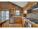This spacious kitchen with stainless steel appliances and granite counters is ready for move-in at 3457 Winter Wood Cv, Marietta, GA 30062