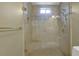 Walk-in shower with seamless glass enclosure and a built-in bench at 3457 Winter Wood Cv, Marietta, GA 30062