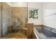 Modern bathroom featuring a glass-enclosed shower and separate soaking tub at 424 Lindbergh Ne Dr # 111, Atlanta, GA 30305