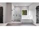 A bathroom featuring a large shower, soaking tub, and a window offering wooded views at 8971 Callaway Dr, Winston, GA 30187