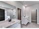 A main bathroom boasts double vanities with stone countertops, a shower and soaking tub at 8971 Callaway Dr, Winston, GA 30187