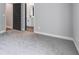 A modern bedroom with carpet and interior door that leads to a bathroom at 8971 Callaway Dr, Winston, GA 30187