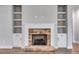 Stylish stone fireplace with built-in shelving and cabinets at 8971 Callaway Dr, Winston, GA 30187