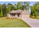 Charming single-story home with a two car garage, and an inviting front porch at 8971 Callaway Dr, Winston, GA 30187