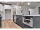Kitchen island with seating, a stainless-steel dishwasher, and plenty of cabinet space at 8971 Callaway Dr, Winston, GA 30187